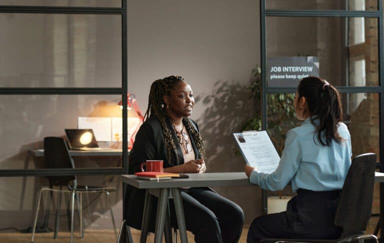 Two people meeting over coffee